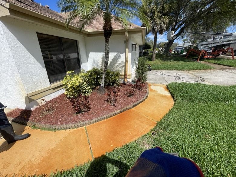 Rust removal treatment applied to a stained concrete walkway